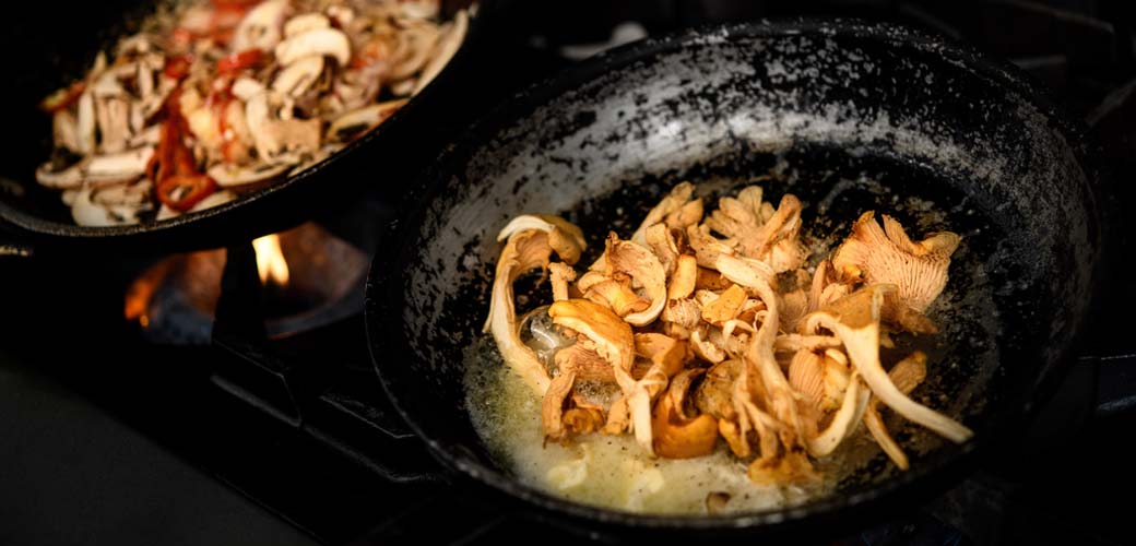 Chef preparing gourmet dishes at The Restaurant at Unsworth Vineyards.